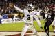 FILE - In this Dec. 20, 2012, file photo, BYU linebacker Kyle Van Noy holds out the ball as he scores on a 17-yard interception return during the fourth quarter of the Poinsettia Bowl NCAA college football game against San Diego State, in San Diego. This weekend, Texas faces a stingy BYU defense that was one of the country's best last season. (AP Photo/Lenny Ignelzi, File)
