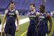Central Florida quarterback Blake Bortles, left, Alabama quarterback AJ McCarron, center, and Louisville quarterback Teddy Bridgewater watch a drill at the NFL football scouting combine in Indianapolis, Sunday, Feb. 23, 2014. (AP Photo/Michael Conroy)