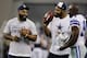 FILE - In this file photo from Aug. 29, 2013, Dallas Cowboys defensive end Anthony Spencer, left, defensive end Jason Hatcher, center, and DeMarcus Ware (94) talk before a preseason NFL football game in Arlington, Texas. Spencer still hasn't returned from a left knee injury that kept him out all of training camp and is listed as doubtful for the season opener against the New York Giants. He missed the last full practice Friday, Sept. 6 before Sunday night's game. He aggravated an injury from offseason workouts in the pre-camp conditioning test and had arthroscopic surgery July 25. Spencer said he had swelling in the knee this week. (AP Photo/Tony Gutierrez, file)