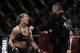 Ronda Rousey, left, hugs her trainer Edmond Tarverdyan after defeating Sara McMann in a UFC 170 mixed martial arts women's bantamweight title fight on Saturday, Feb. 22, 2014, in Las Vegas. (AP Photo/Isaac Brekken)