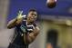 Buffalo linebacker Khalil Mack runs a drill at the NFL football scouting combine in Indianapolis, Monday, Feb. 24, 2014. (AP Photo/Michael Conroy)