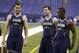 Central Florida quarterback Blake Bortles, left, Alabama quarterback AJ McCarron, center, and Louisville quarterback Teddy Bridgewater watch a drill at the NFL football scouting combine in Indianapolis, Sunday, Feb. 23, 2014. (AP Photo/Michael Conroy)