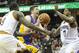 Feb 5, 2014; Cleveland, OH, USA; Los Angeles Lakers power forward Ryan Kelly (center) drives between Cleveland Cavaliers small forward Luol Deng (9) and power forward Tristan Thompson in the second quarter at Quicken Loans Arena. Mandatory Credit: David Richard-USA TODAY Sports