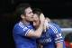 Chelsea's Frank Lampard, left, embraces his captain John Terry, after scoring against Everton during an English Premier League soccer match at the Stamford Bridge ground in London, Saturday, Feb. 22, 2014. Chelsea won the match 1-0. (AP Photo/Lefteris Pitarakis)