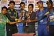 Bangladesh cricket team captain Mushfiqur Rahim, left, Pakistan cricket team captain Misbah-ul-Haq, second left, India cricket team captain Virat Kohli, third left, Afghanistan cricket team captain Mohammad Nabi, second right and Sri Lanka cricket team captain Angelo Mathews right, pose with the trophy ahead of the Asia Cup tournament in Dhaka, Bangladesh, Monday, Feb. 24, 2014. The person in the center is unidentified. Pakistan plays Sri Lanka in the opening match of the five nation one day cricket event that begins Tuesday.(AP Photo/A.M. Ahad)