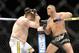 Dec 15, 2012; Las Vegas, NV, USA; Roy Nelson (left) is punched by Matt Mitrione (right) during their heavyweight bout in the Ultimate Fighter Finale at The Joint at the Hard Rock Hotel and Casino. Nelson won by KO. Mandatory Credit: Josh Holmberg-USA TODAY Sports