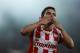Javier Saviola celebrates his first goal with Olympiakos, against Atromitos during a Greek league soccer match at the Karaiskaki stadium in the port of Piraeus, near Athens, Sunday, Aug. 25, 2013. Javier Saviola scored the winner with a header in the 54th minute to give Olympiakos a 2-1 victory over visiting Atromitos in the Greek league. (AP Photo/Kostas Tsironis)