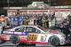 Dale Earnhardt Jr. celebrates with his crew in Victory Lane after winning the NASCAR Daytona 500 Sprint Cup series auto race at Daytona International Speedway in Daytona Beach, Fla., Sunday, Feb. 23, 2014. (AP Photo/Terry Renna)