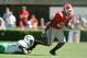Georgia's Thomas Brown (20) loses his shoe while eluding a tackle by Marshall's Curtis Keyes during the the first half, Saturday, Sept. 18, 2004, at Sanford Stadium in Athens, Ga. (AP Photo/Rob Carr)