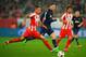 PIRAEUS, GREECE - FEBRUARY 25: Jose Holebas (L) of Olympiacos holds off the challenge of Wayne Rooney of Manchester United during the UEFA Champions League Round of 16 first leg match between Olympiacos FC and Manchester United at Karaiskakis Stadium on February 25, 2014 in Piraeus, Greece. (Photo by Michael Regan/Getty Images)