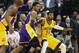 Feb 25, 2014; Indianapolis, IN, USA; Los Angeles Lakers guard Kent Bazemore (6) guards Indiana Pacers forward Paul George (24) at Bankers Life Fieldhouse. Mandatory Credit: Brian Spurlock-USA TODAY Sports