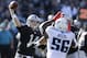 Oakland Raiders quarterback Matt McGloin (14) passes as Tennessee Titans outside linebacker Akeem Ayers (56) applies pressure during the first half of an NFL football game in Oakland, Calif., Sunday, Nov. 24, 2013. (AP Photo/Ben Margot)