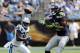 Sep 8, 2013; Charlotte, NC, USA; Seattle Seahawks wide receiver sidney Rice (18) catches a pass while pursued by Carolina Panthers safety Charles Godfrey (30) during the game at Bank of America Stadium. Mandatory Credit: Sam Sharpe-USA TODAY Sports