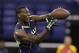 USC wide receiver Marqise Lee makes a catch during a drill at the NFL football scouting combine in Indianapolis, Sunday, Feb. 23, 2014. (AP Photo/Michael Conroy)