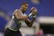 Michigan State defensive back Darqueze Dennard runs a drill at the NFL football scouting combine in Indianapolis, Tuesday, Feb. 25, 2014. (AP Photo/Michael Conroy)