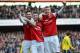 LONDON, ENGLAND - FEBRUARY 22: Laurent Koscielny of Arsenal (C) celebrates with team-mates Olivier Giroud of Arsenal (L) and Per Mertesacker of Arsenal after scoring their third goal during the Barclays Premier League match between Arsenal and Sunderland at Emirates Stadium on February 22, 2014 in London, England. (Photo by Michael Regan/Getty Images)