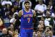 New York Knicks small forward Carmelo Anthony (7) smiles after scoring during the second half of an NBA basketball game against the New Orleans Pelicans in New Orleans, Wednesday, Feb. 19, 2014. The Knicks won 98-91. (AP Photo/Jonathan Bachman)
