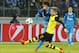 Borussia's Marco Reus blocks Zenit's Axel Witsel, right, from making a kick during the Champions League soccer match between Zenit St.Petersburg and Borussia Dortmund at Petrovsky stadium in St.Petersburg, Russia, on Tuesday, Feb. 25, 2014. (AP Photo/Dmitry Lovetsky)