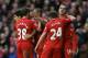 LIVERPOOL, ENGLAND - FEBRUARY 23: Jordan Henderson of Liverpool celebrates scoring his team's fourth goal with his team-mates during the Barclays Premier League match between Liverpool and Swansea City at Anfield on February 23, 2014 in Liverpool, England. (Photo by Clive Brunskill/Getty Images)