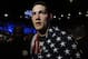 Chris Weidman, of Baldwin, N.Y., walks after defeating Anderson Silva, of Brazil, during the UFC 168 mixed martial arts middleweight championship bout on Saturday, Dec. 28, 2013, in Las Vegas. Weidman won during the second round by a technical knockout after Silva was injured. (AP Photo/David Becker)