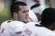 Fresno State quarterback Derek Carr talks with a teammates on the sidelines after throwing an interception against San Jose State during the second half of an NCAA college football game on Friday, Nov. 29, 2013, in San Jose, Calif. San Jose State won 62-52. (AP Photo/Tony Avelar)