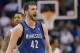 Minnesota Timberwolves forward Kevin Love (42) yells after hitting a three pointer against the Phoenix Suns during the second half of an NBA basketball game, Tuesday, Feb. 25, 2014, in Phoenix. (AP Photo/Matt York)