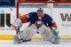 UNIONDALE, NY - FEBRUARY 06: Goalie Evgeni Nabokov #20 of the New York Islanders watches the puck during an NHL hockey game against the Calgary Flames at Nassau Veterans Memorial Coliseum on February 6, 2014 in Uniondale, New York. (Photo by Paul Bereswill/NHLI via Getty Images)