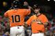 SAN FRANCISCO, CA - SEPTEMBER 27: Brandon Belt #9 of the San Francisco Giants is congratulated by Tony Abreu #10 after hitting a two-run home run during the third inning against the San Diego Padres at AT&T Park on September 27, 2013 in San Francisco, California. (Photo by Thearon W. Henderson/Getty Images)