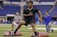 Pittsburgh defensive lineman Aaron Donald runs a drill at the NFL football scouting combine in Indianapolis, Monday, Feb. 24, 2014. (AP Photo/Michael Conroy)