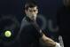 Novak Djokovic of Serbia returns the ball to Denis Istomin of Uzbekistan during the second round of the Dubai Duty Free Tennis Championships in Dubai, United Arab Emirates, Tuesday, Feb. 25, 2014. (AP Photo/Kamran Jebreili)