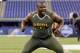 Auburn offensive lineman Greg Robinson runs a drill at the NFL football scouting combine in Indianapolis, Saturday, Feb. 22, 2014. (AP Photo/Michael Conroy)