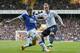 Tottenham's Christian Eriksen, right, attempts to cross as Everton's Phil Jagielka blocks during their English Premier League soccer match at the White Hart Lane stadium in London, Sunday, Feb. 9 2014. (AP Photo/Alastair Grant)