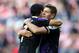 Liverpool's Luis Suarez, left, celebrates scoring his goal with captain Steven Gerrard, right, during their English Premier League soccer match against Sunderland at the Stadium of Light, Sunderland, England, Sunday, Sept. 29, 2013. (AP Photo/Scott Heppell)l)