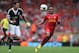 LIVERPOOL, ENGLAND - SEPTEMBER 21: Raheem Sterling of Liverpool in action with Jose Fonte of Southampton during the Barclays Premier League match between Liverpool and Southampton at Anfield on September 21, 2013 in Liverpool, England. (Photo by Clive Brunskill/Getty Images)