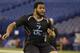 Pittsburgh defensive lineman Aaron Donald runs a drill at the NFL football scouting combine in Indianapolis, Monday, Feb. 24, 2014. (AP Photo/Michael Conroy)