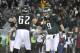 Philadelphia Eagles' Nick Foles, right, and Jason Kelce celebrate after a two-point conversion during the second half of an NFL football game, Sunday, Dec. 8, 2013, in Philadelphia. (AP Photo/Matt Rourke)