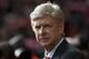 Arsenal's manager Arsene Wenger takes to the touchline before his team's English Premier League soccer match against Liverpool at Anfield Stadium, Liverpool, England, Saturday Feb. 8, 2014. (AP Photo/Jon Super)
