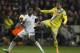 Swansea's Wilfried Bony, left, fights for the ball against Napoli's Henrique during their Europa League round of 32 first leg soccer match at the Liberty Stadium, Swansea, Wales, Thursday Feb. 20, 2014. (AP Photo/Jon Super)