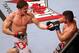 Nov 17, 2012; Montreal, QC, Canada; Matthew Riddle (left) punches John Maguire during their Welterweight bout at UFC 154 at the Bell Centre. Mandatory Credit: Tom Szczerbowski-USA TODAY Sports