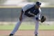 Seattle Mariners second baseman Robinson Cano (22) fields grounders during spring training baseball practice, Tuesday, Feb. 18, 2014, in Peoria, Ariz. (AP Photo/Rick Scuteri)