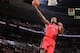 PORTLAND, OR - FEBRUARY 1: Amir Johnson #15 of the Toronto Raptors dunks against the Portland Trail Blazers on February 1, 2014 at the Moda Center Arena in Portland, Oregon. NOTE TO USER: User expressly acknowledges and agrees that, by downloading and or using this photograph, user is consenting to the terms and conditions of the Getty Images License Agreement. Mandatory Copyright Notice: Copyright 2014 NBAE (Photo by Sam Forencich/NBAE via Getty Images)