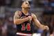 Feb 19, 2014; Toronto, Ontario, CAN; Chicago Bulls guard D.J. Augustin (14) celebrates a three-pointer against the Toronto Raptors at Air Canada Centre. The Bulls beat the Raptors 94-92. Mandatory Credit: Tom Szczerbowski-USA TODAY Sports