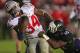 EVANSTON, IL - OCTOBER 05: Carlos Hyde #34 of the Ohio State Buckeyes breaks away from Traveon Henry #10 of the Northwestern Wilcats to score a second half touchdown at Ryan Field on October 5, 2013 in Evanston, Illinois. Ohio State defeated Northwestern 40-30. (Photo by Jonathan Daniel/Getty Images)