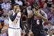 New York Knicks small forward Carmelo Anthony (7) and Miami Heat small forward LeBron James (6) talk during the second half of an NBA basketball game in Miami, Thursday, Feb. 27, 2014. The Heat won 108-82. (AP Photo/Alan Diaz)