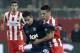 Olympiakos' Herman Perez, right, fights for the ball with Manchester United's Robin Van Persie during their Champions League, round of 16, first leg soccer match at Georgios Karaiskakis stadium, in Piraeus port, near Athens, on Tuesday, Feb. 25, 2014. (AP Photo/Petros Giannakouris)