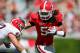 April 14, 2011; Athens, GA, USA; Georgia Bulldogs linebacker Ramik Wilson (51) stiff-arms fullback Dustin Royston (42) while returning an interception in the first half of the Georgia spring game at Sanford Stadium. Mandatory Credit: Daniel Shirey-USA TODAY Sports