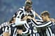 Juventus defender Giorgio Chiellini, back to camera, celebrates with teammates after scoring during a Serie A soccer match between Juventus and Inter Milan at the Juventus stadium, in Turin, Italy, Sunday, Feb. 2, 2014. (AP Photo/Massimo Pinca)