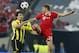 Bayern's Thomas Mueller, left, vies for the ball with Dortmund's Mats Hummels, during the Champions League Final between Borussia Dortmund and Bayern Munich at Wembley Stadium in London, Saturday May 25, 2013. (AP Photo/Jon Super)