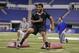 Pittsburgh defensive lineman Aaron Donald runs a drill at the NFL football scouting combine in Indianapolis, Monday, Feb. 24, 2014. (AP Photo/Michael Conroy)