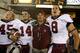 ** FILE ** In this Oct. 6, 2007 file photo, Stanford's Ben Ladner, Tavita Pritchard, coach Jim Harbaugh, and Evan Moore, from left, celebrate after Stanford upset Southern California 24-23 in an NCAA college football game in Los Angeles. Nobody around Southern California has forgotten the Stanford debacle of last year, when the 41-point underdog Cardinal handed the Trojans their only loss at Los Angeles Coliseum in the past 43 games. No. 6 USC, a 23-point favorite, gets a shot at revenge this weekend in Palo Alto. (AP Photo/Matt Sayles, File)